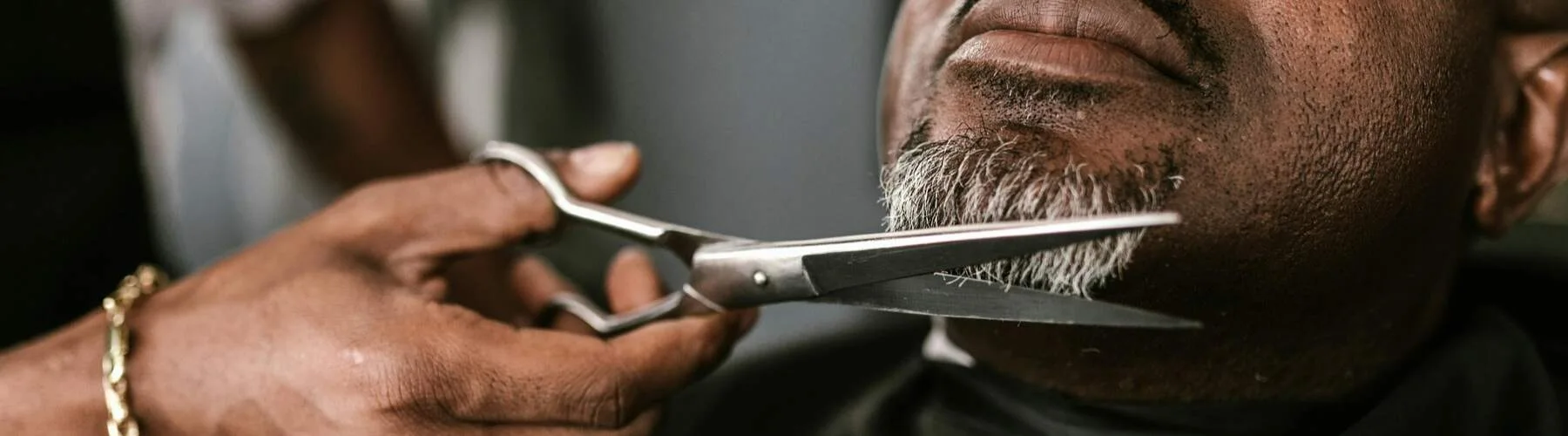 Well-groomed man maintaining his beard care routine between barbershop visits