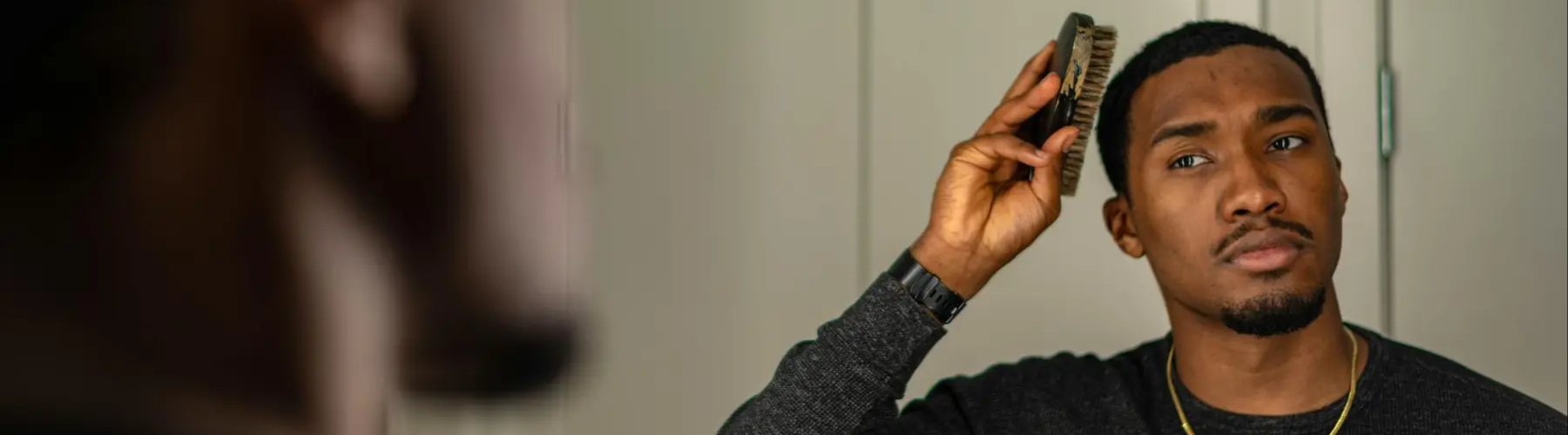 Master barber giving a precise fade haircut