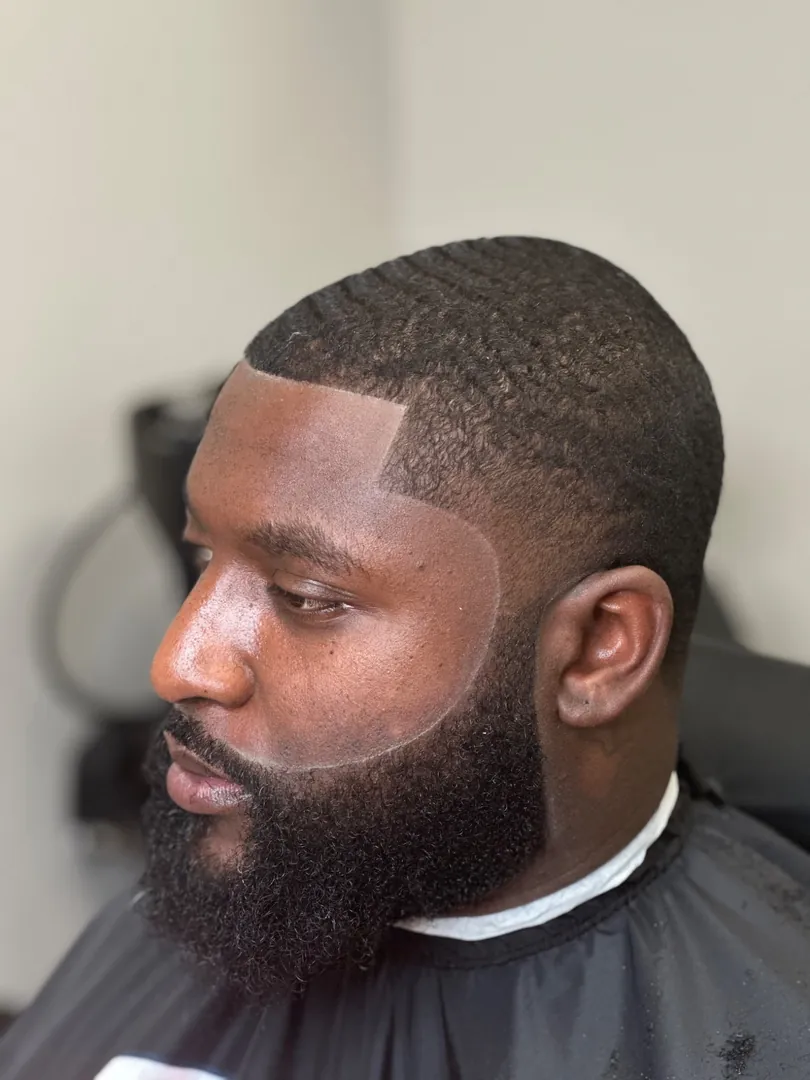 A temple taper with 360 waves, a squared temple, and a connected beard, by Clifton Al-Hakeem in Owings Mills