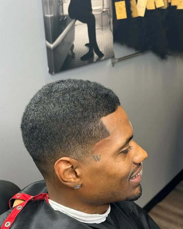 Short taper with a crisp lineup by Clifton Bey at Al-Hakeem's Tonsorial